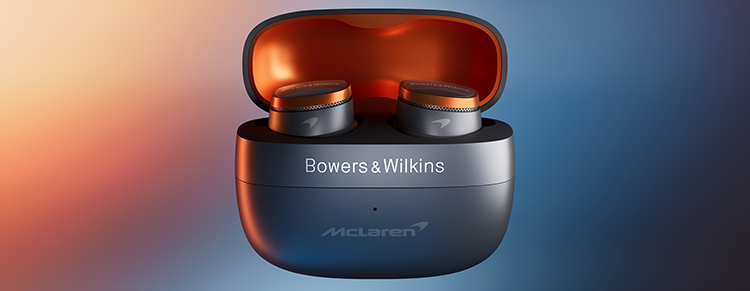 Bowers and Wilkins Pi8 McLaren Edition Wireless Earbuds situated inside its open carrying case