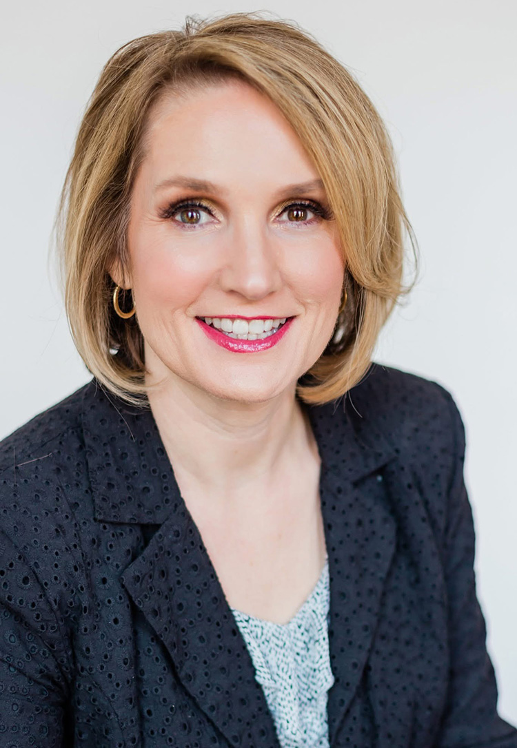 Portrait orientation close-up photograph headshot of Tricia Nystrom smiling