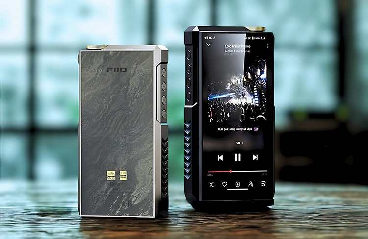 Digital rendering close-up image display of the FiiO M27 portable music players standing side by side each other at an angle on a dark wooden surface