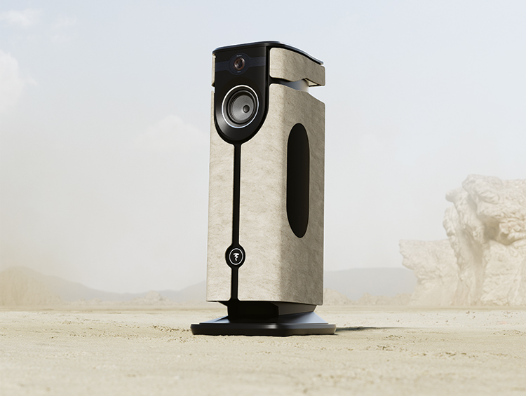 Digital portrait orientation promotional image display of the Focal Diva Mezza Utopia floorstanding active loudspeaker situated within a desert biome setting