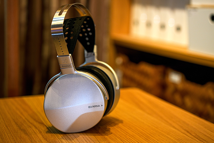 HIFIMAN ISVARNA Hybrid Headphone on top of a wooden table surface Angle Lifestyle View