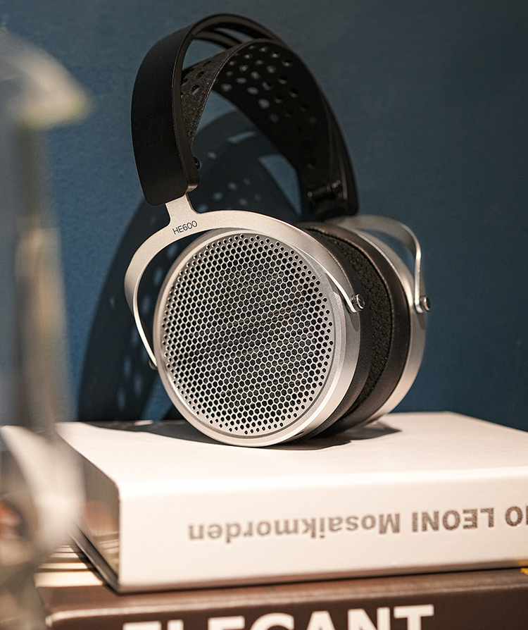 HIFIMAN HE600 open-back planar magnetic headphones Angle View positioned on top of some random various books
