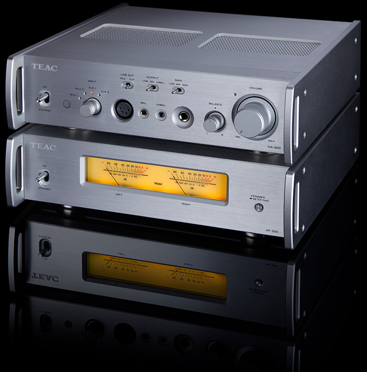 TEAC Reference 500 Series HA-507 Pure Analog Headphone Amplifier/Preamplifier Silver Finish stacked on top of TEAC Reference 500 Series AP-505 Stereo Power Amplifier Silver Finish Angle View