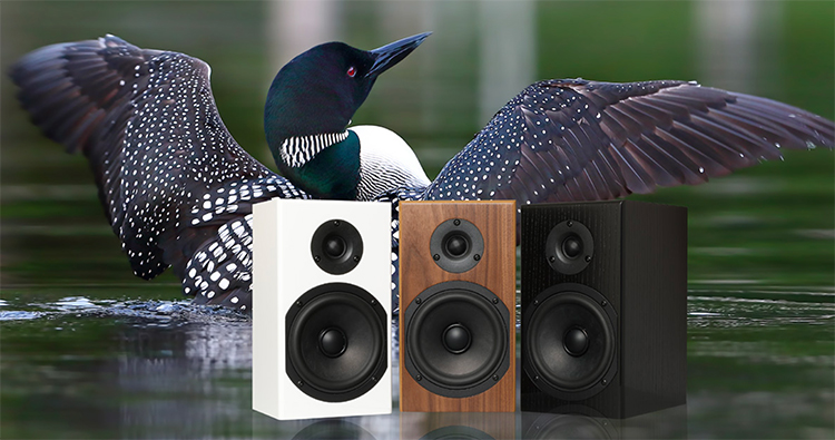 Digital lifestyle banner showcasing the Totem Acoustic LOON Monitor Bookshelf Speakers (Satin White, Black Walnut, and Black Ash Finishes) with a loon bird in the water as the backdrop background
