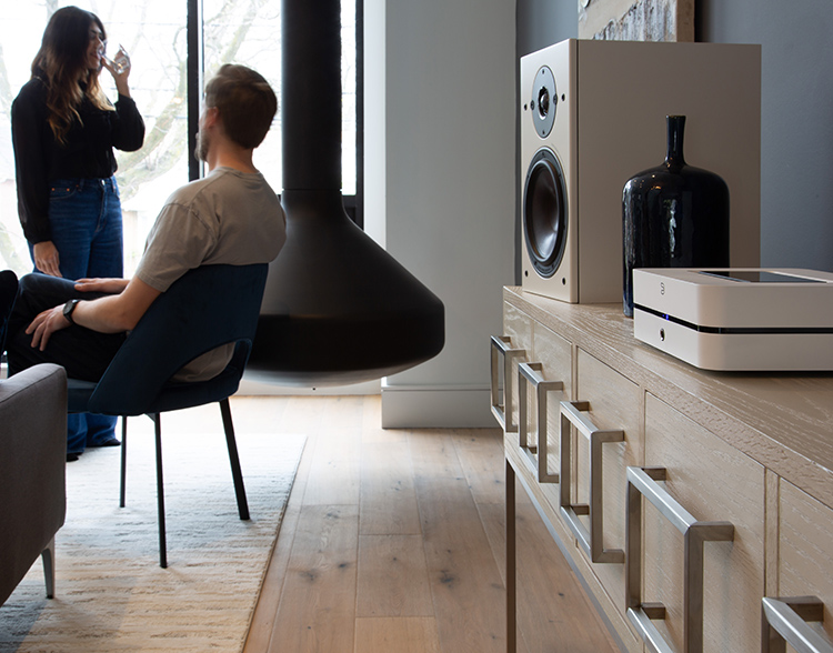 Bluesound POWERNODE next-generation wireless music streaming amplifier Living Room Lifestyle View