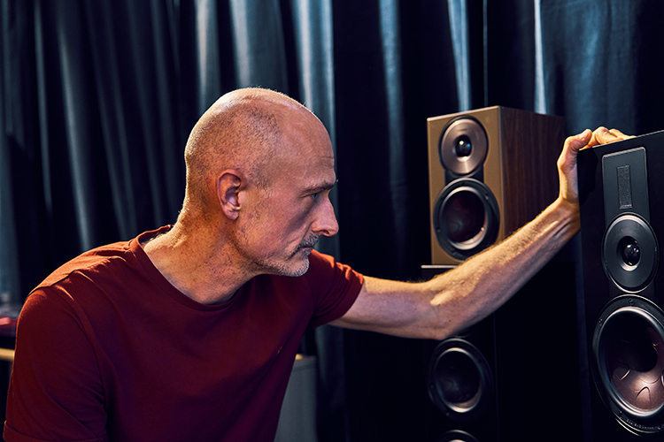 Krestian Pedersen, DALI Head of Product Management, seen examining something on one of the DALI loudspeaker models