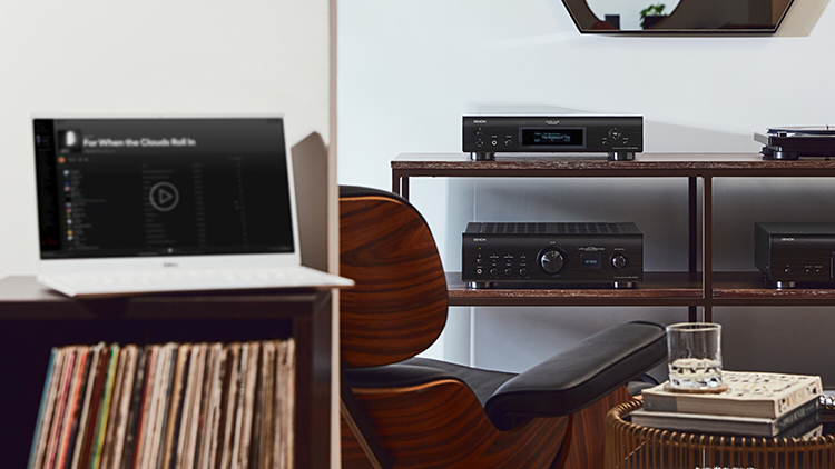 Denon DNP-2000NE Network Player located next to a turntable and other Denon products down below within the living room area