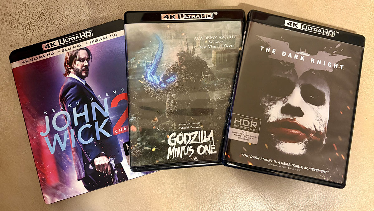 4K UltraHD DVD movie covers of John Wick: Chapter 2, Godzilla Minus One, and The Dark Knight 4K UltraHD DVD movie covers of John Wick: Chapter 2, Godzilla Minus One, and The Dark Knight