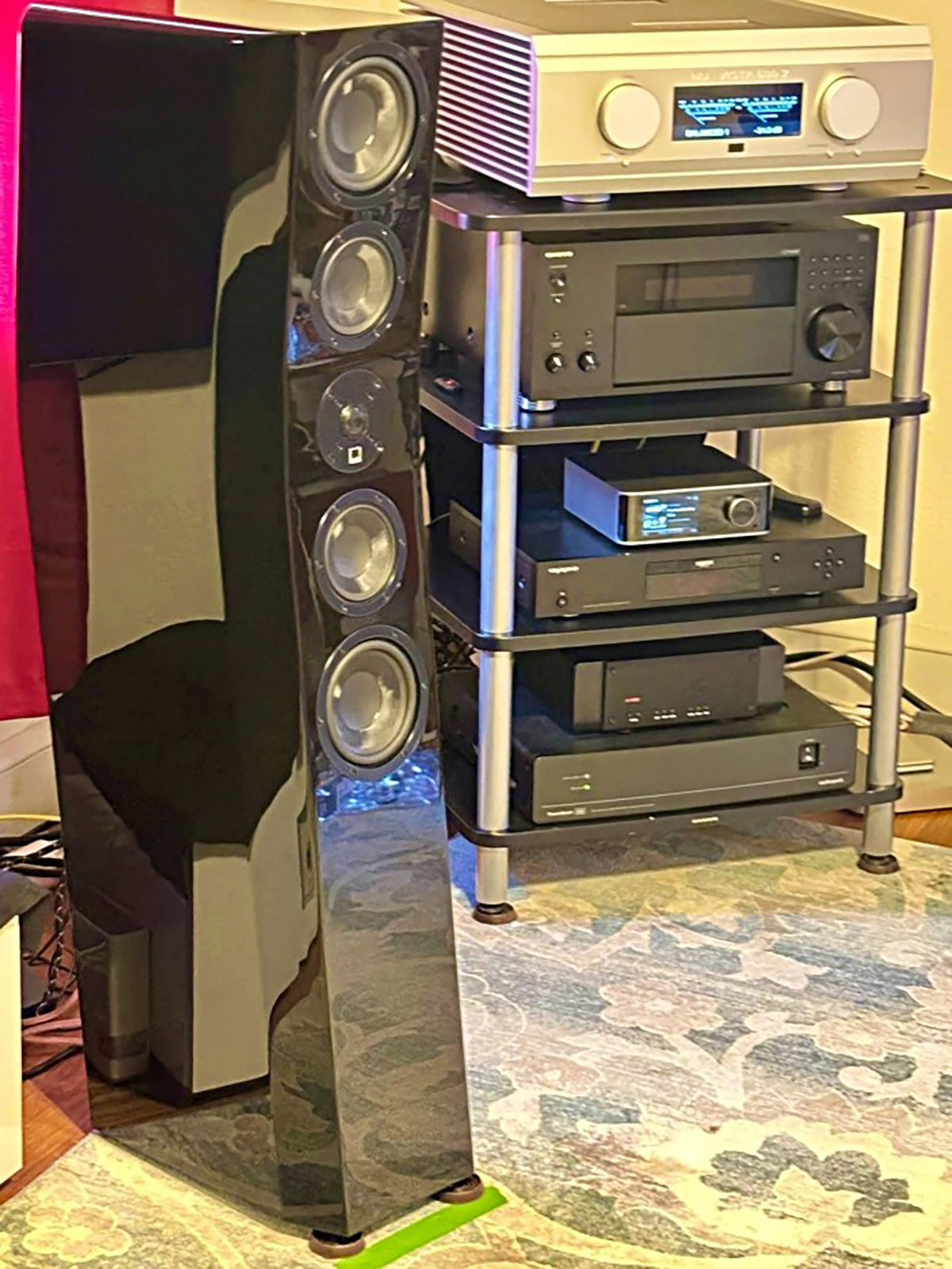 SVS Ultra Evolution Tower Speaker alongside a rack full of other various random assorted home theater audio high fidelity product models SVS Ultra Evolution Tower Speaker alongside a rack full of other various random assorted home theater audio high fidelity product models