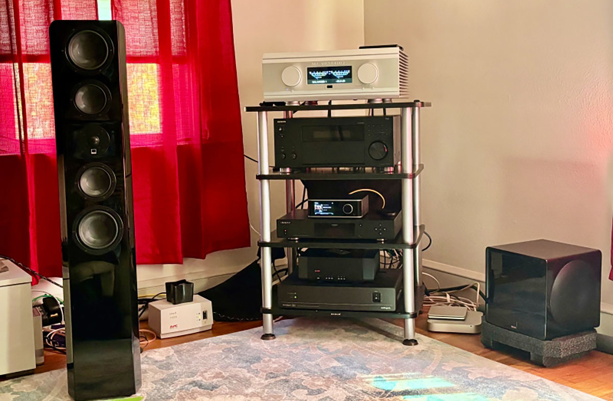 SVS Ultra Evolution Tower Speaker hooked up and situated alongside a rack full of other various random assorted home theater audio high fidelity product models SVS Ultra Evolution Tower Speaker hooked up and situated alongside a rack full of other various random assorted home theater audio high fidelity product models