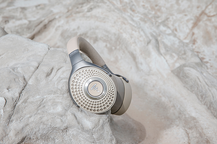 Focal Bathys Dune Finish Headphone resting on the side of a desert rock/canyon rock area