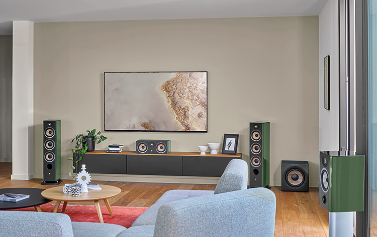 Focal Aria Evo X line of high-fidelity loudspeakers for the home featuring two slender floorstanding loudspeakers, a compact bookshelf speaker model (Aria Evo X No1), a small Focal subwoofer model, and a Home Cinema configuration speaker model (Aria Evo X Center)