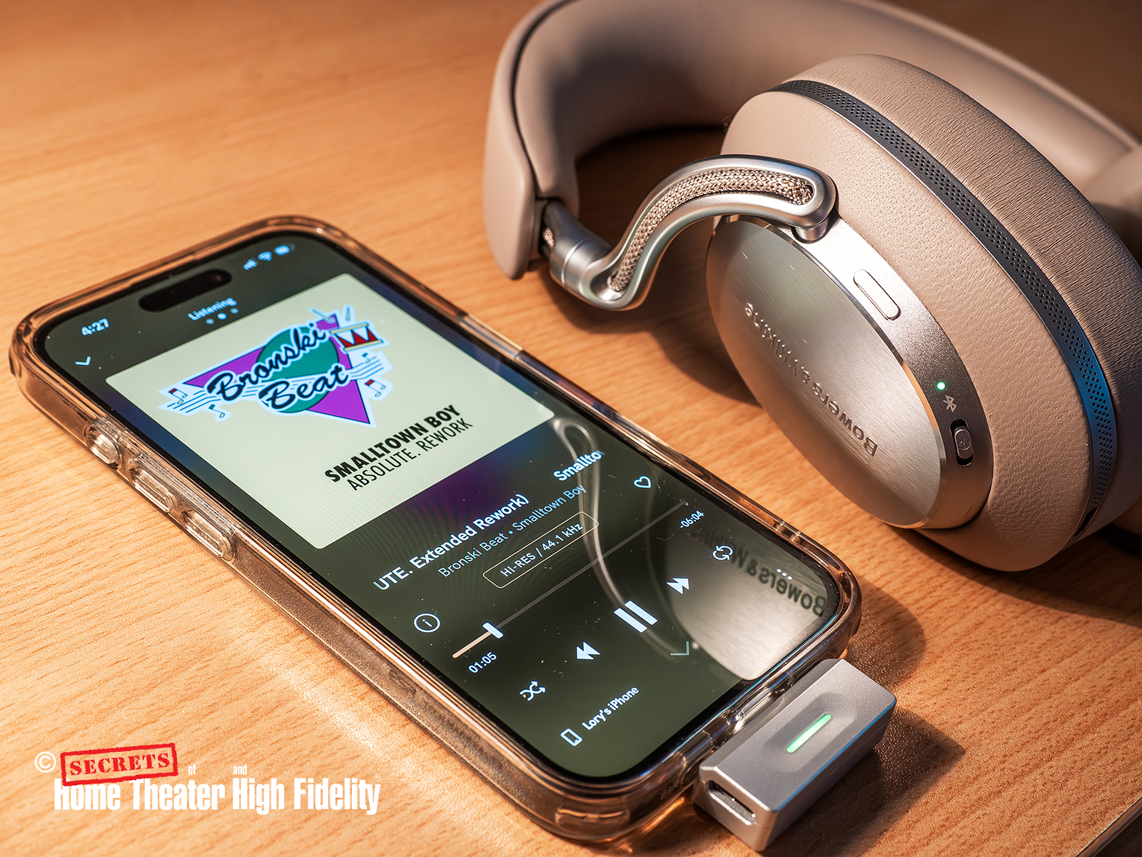 Bowers & Wilkins Px8 S2 Over-Ear Noise-Canceling Headphones situated next to an Apple iPhone device Bowers & Wilkins Px8 S2 Over-Ear Noise-Canceling Headphones situated next to an Apple iPhone device