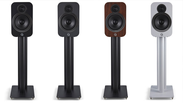 Q Accoustic Speakers In Different Colors On Stands