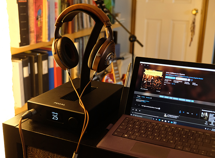 Stellia Headphones and Arche AMP/DAC Next to a Laptop