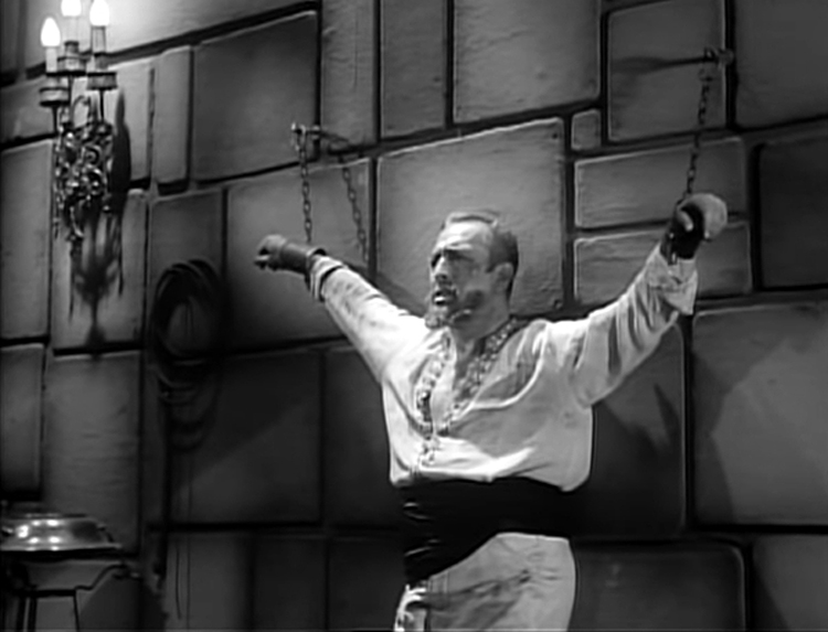 The Sultan chained to a wall in the film