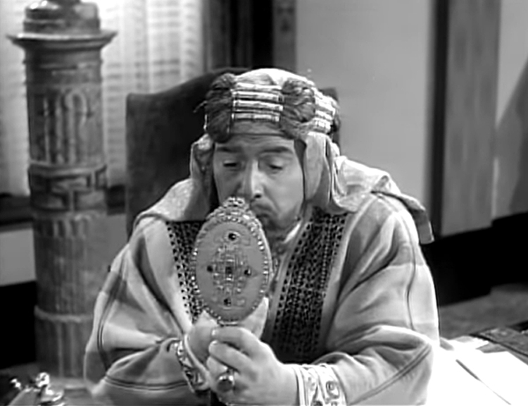 A Nazi dressed as the Sultan looking at himself in a mirror