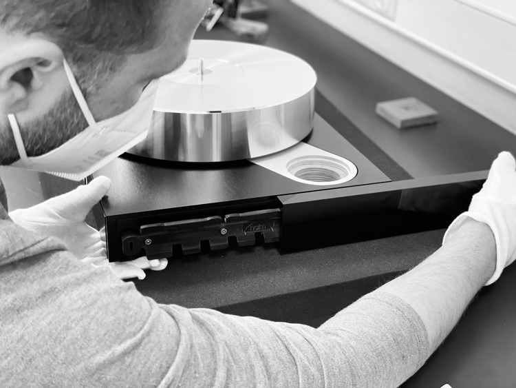 Black and white photo of a Clearaudio employee crafting the Naim Solstice Turntable NVS TT