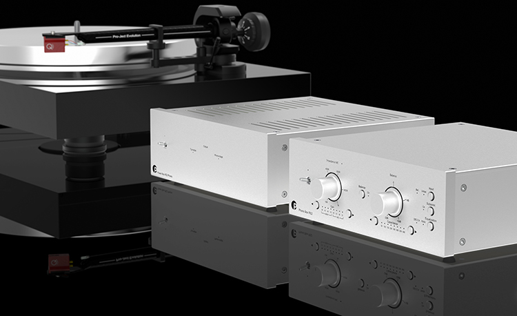 Pro-Ject Power Box RS2 Phono Silver Finish situated next to a turntable and a phono preamp
