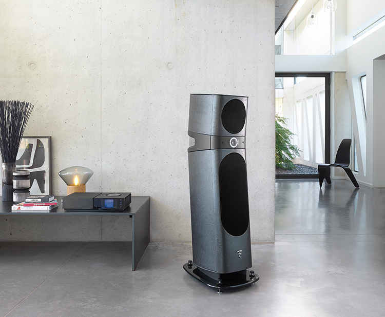 Focal Sopra N°2 Loudspeaker Black Ostrea Finish (with grille) situated in the living room nearby a desk closer to the edge of the wall