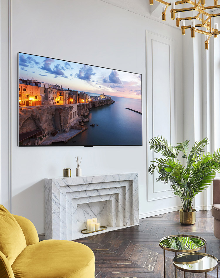 An LG OLED evo TV is displayed on a living room wall