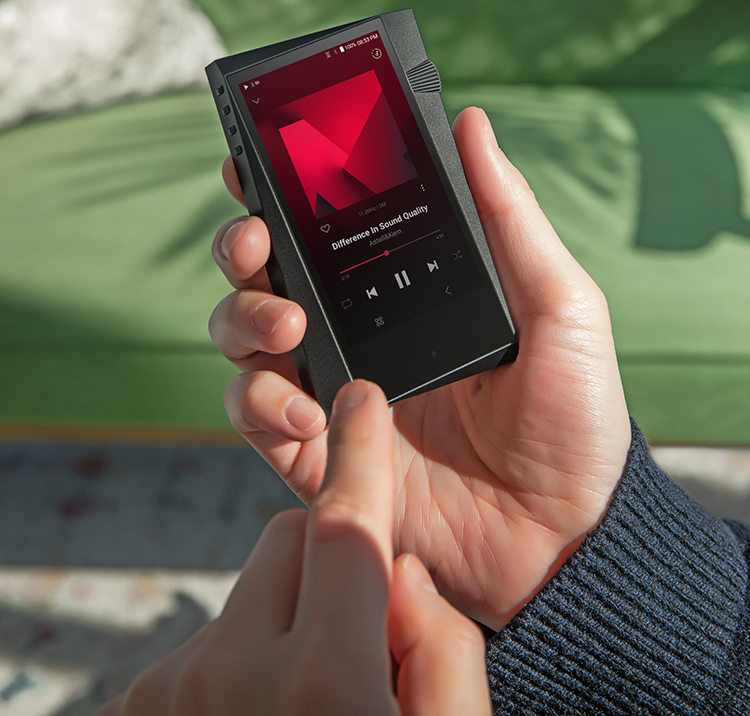 Astell&Kern A&norma SR35 Digital High-Resolution Audio Player held in hand by a person outside